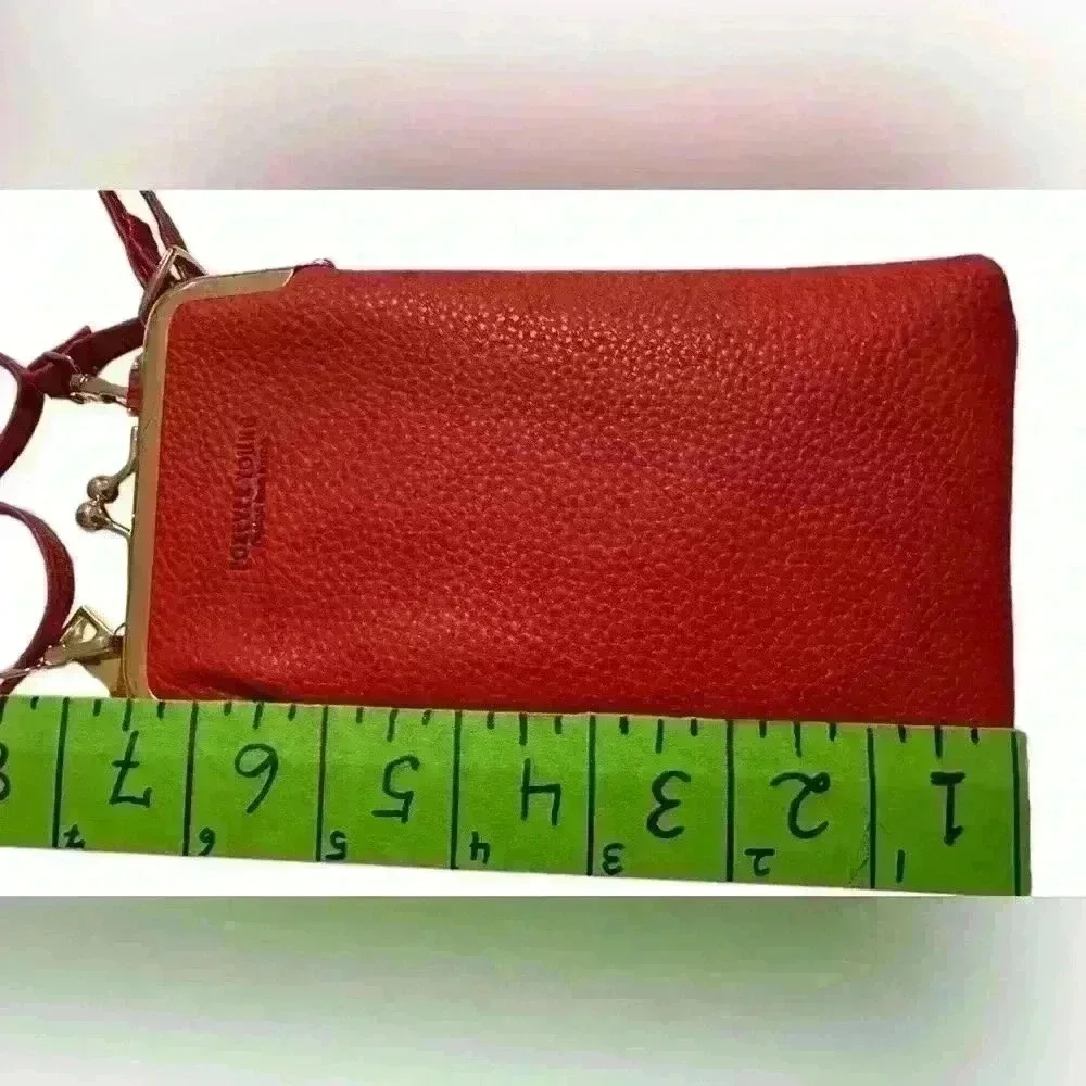 A Forever Young red woman’s,Crossbody bag / wallet with attached iPhone carrier.